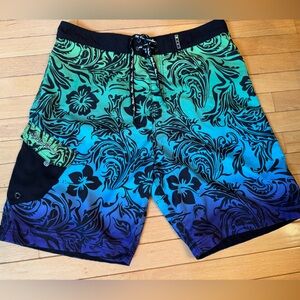 Maui and Sons size 36/L board shorts knee length. Multicolor & floral pattern.